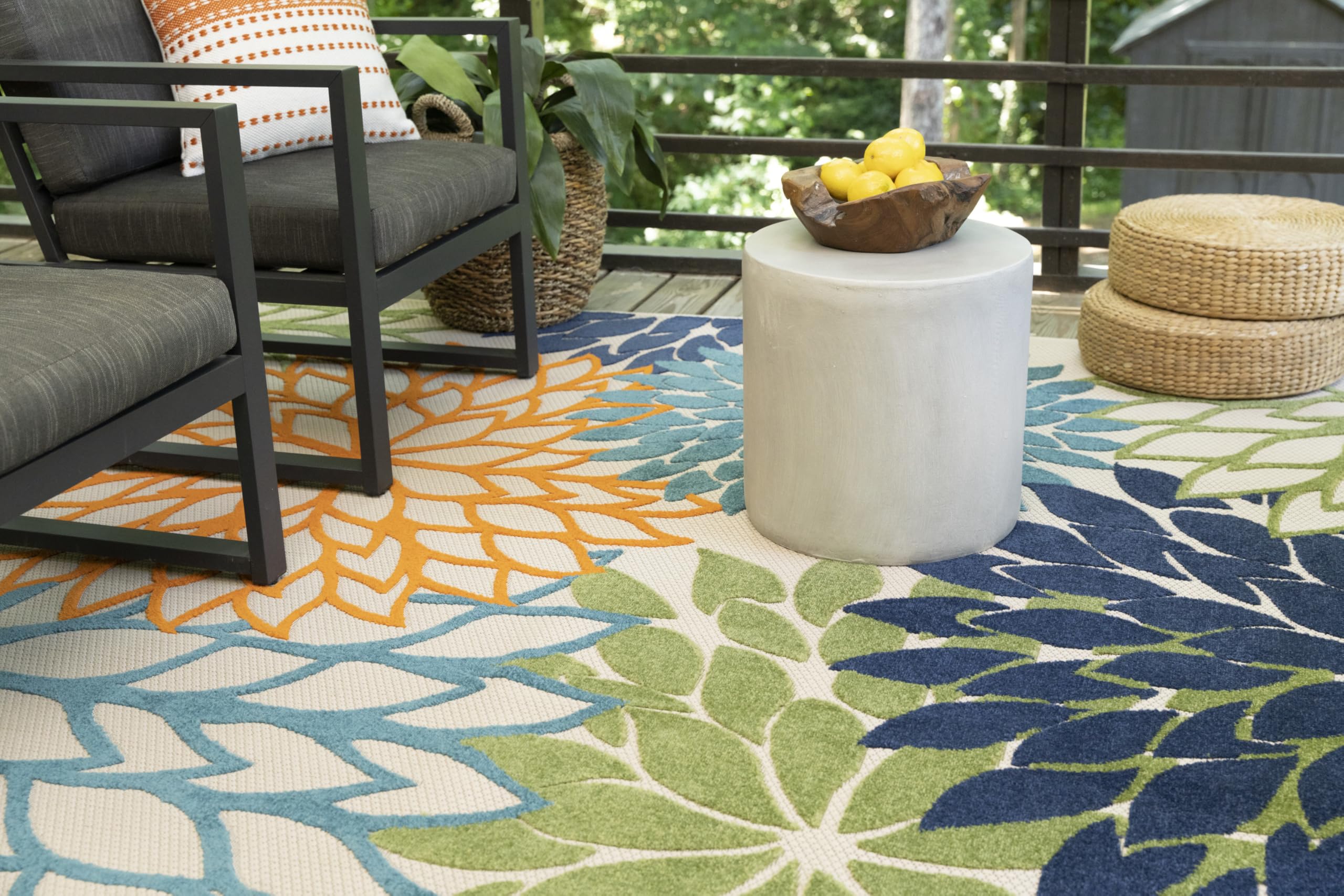 Nourison rug being hosed off for quick outdoor cleaning