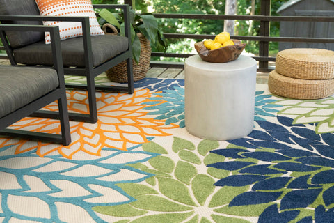 Nourison rug being hosed off for quick outdoor cleaning