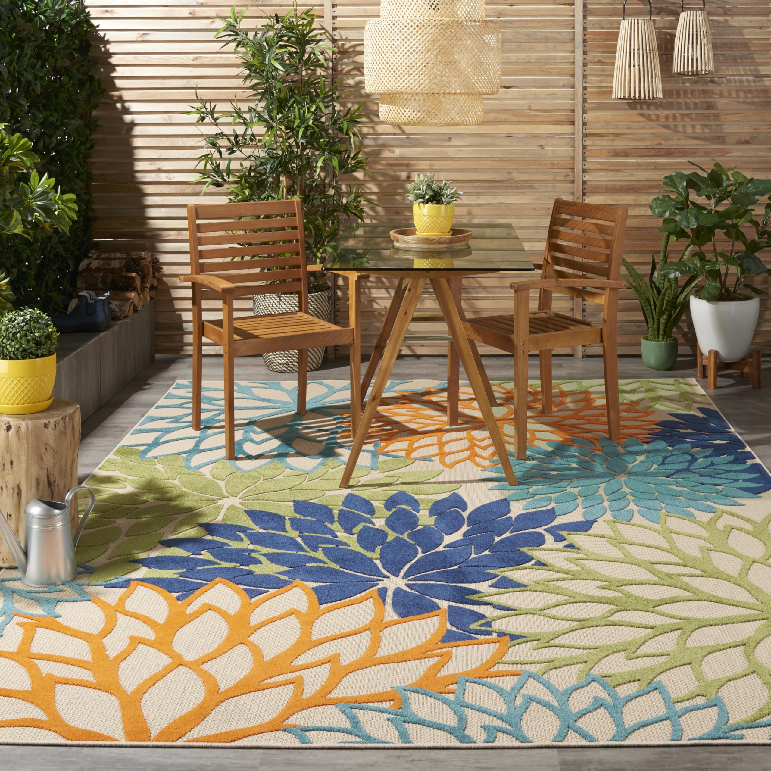 Nourison rug under outdoor dining set creating inviting seating area