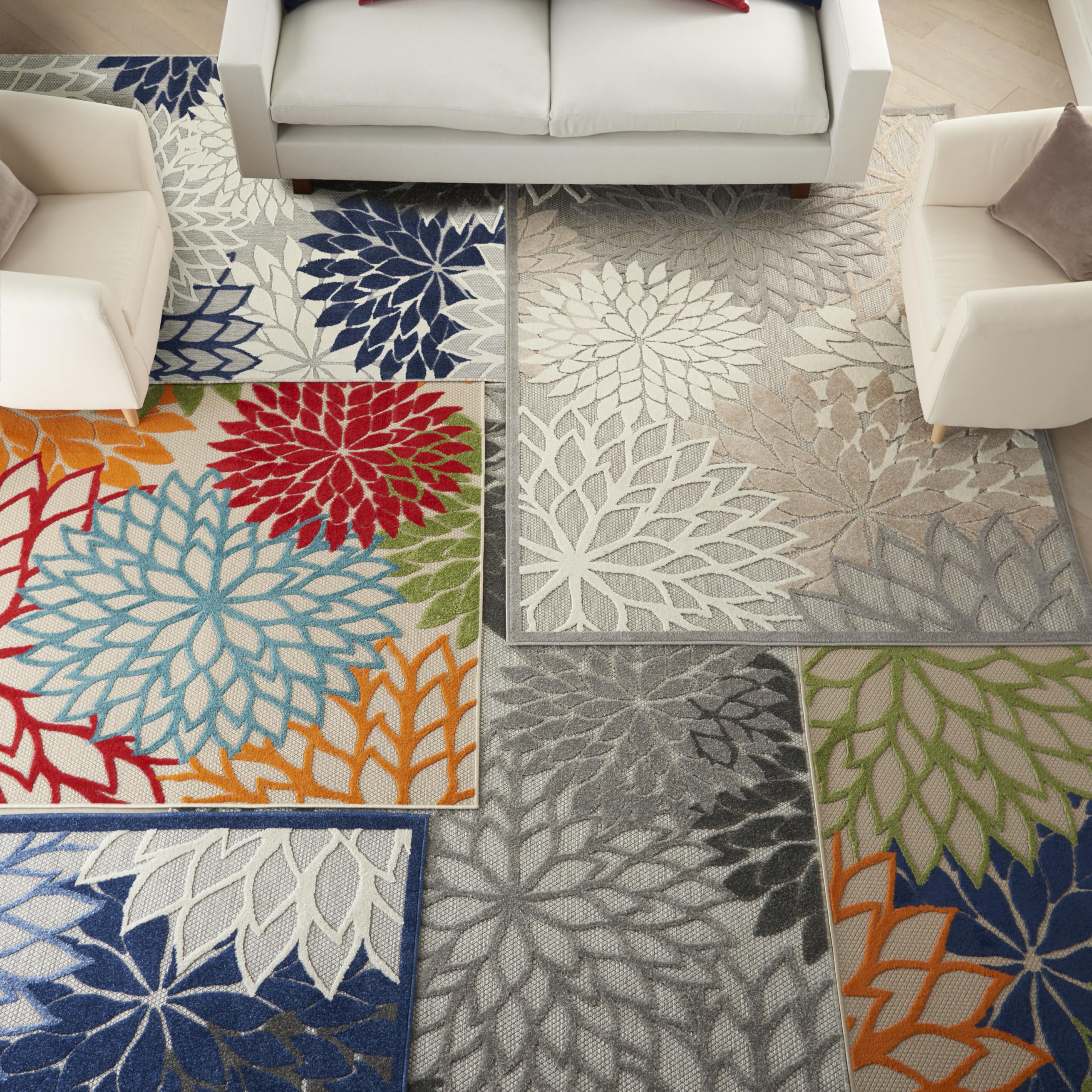 Nourison rug sized with sofa to show proper 8x10 placement