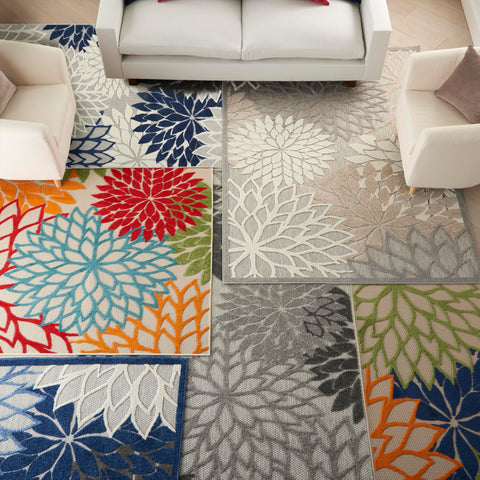 Nourison rug sized with sofa to show proper 8x10 placement