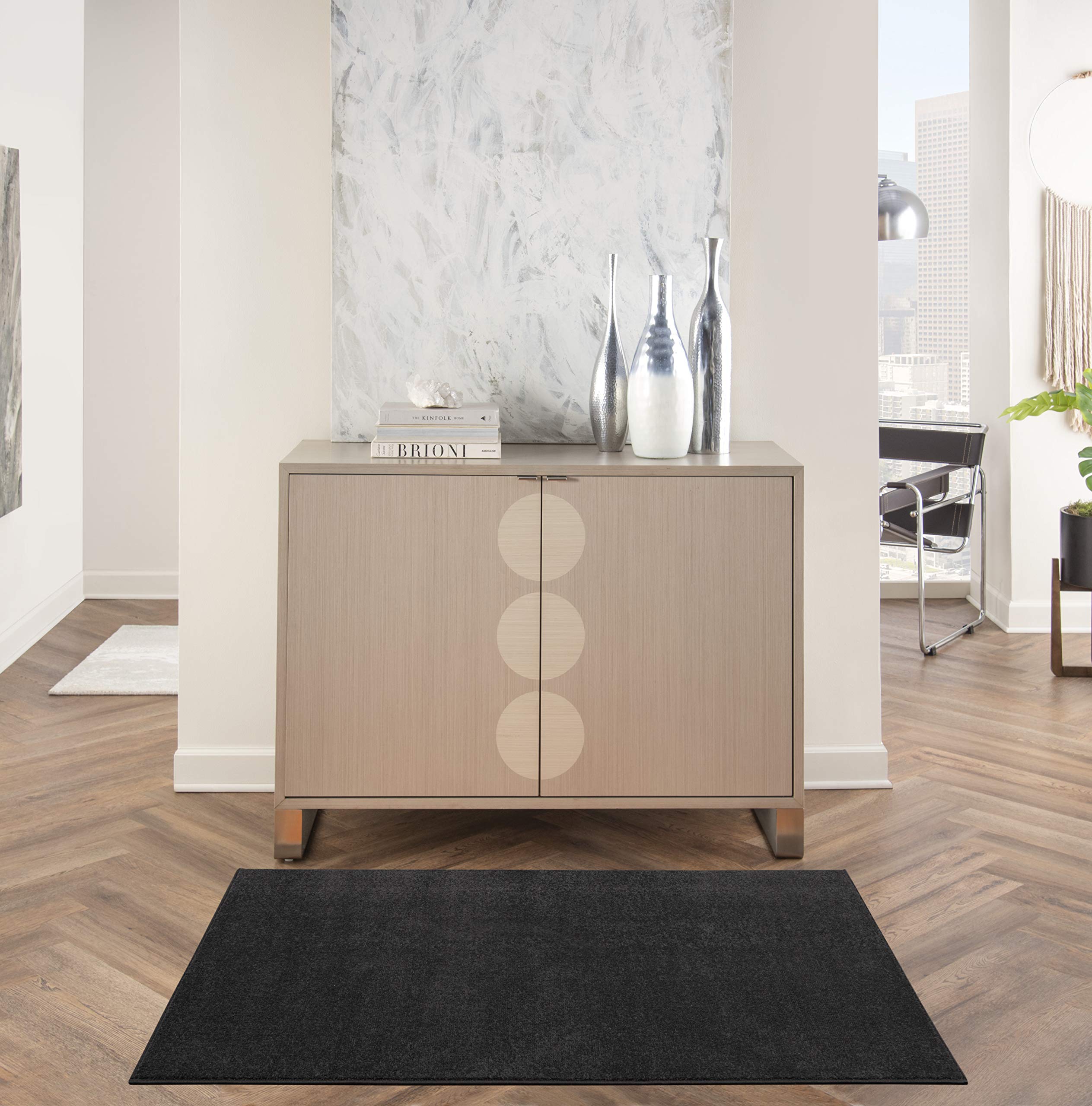 Nourison black rug front view showing modern look and durable design
