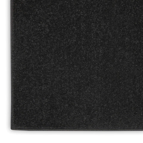 Nourison under sofa in living room showing anchoring effect and style