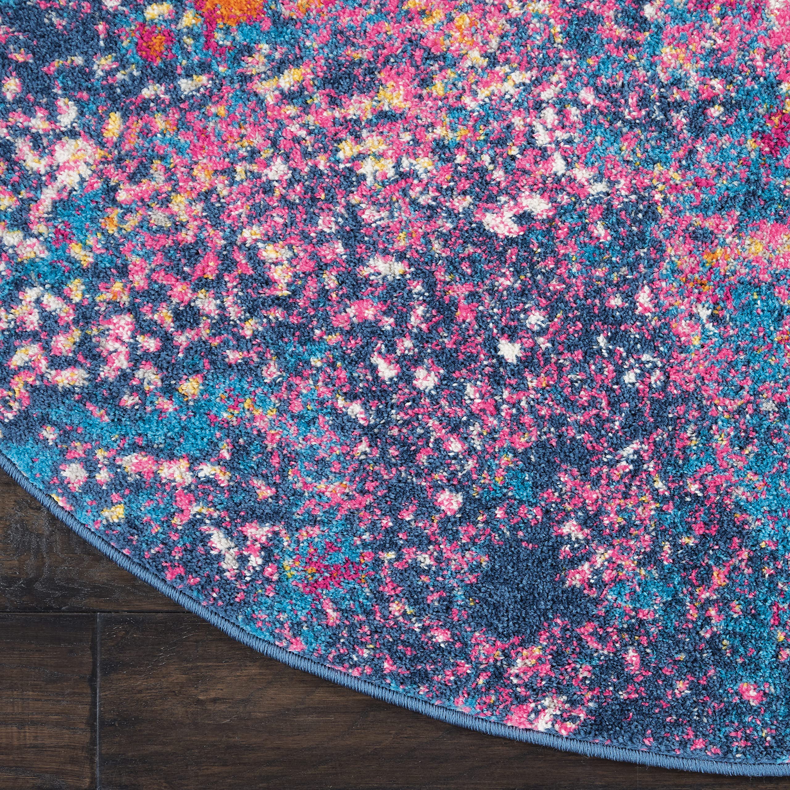 Nourison Passion in living room illustrating how the round rug anchors a seating area