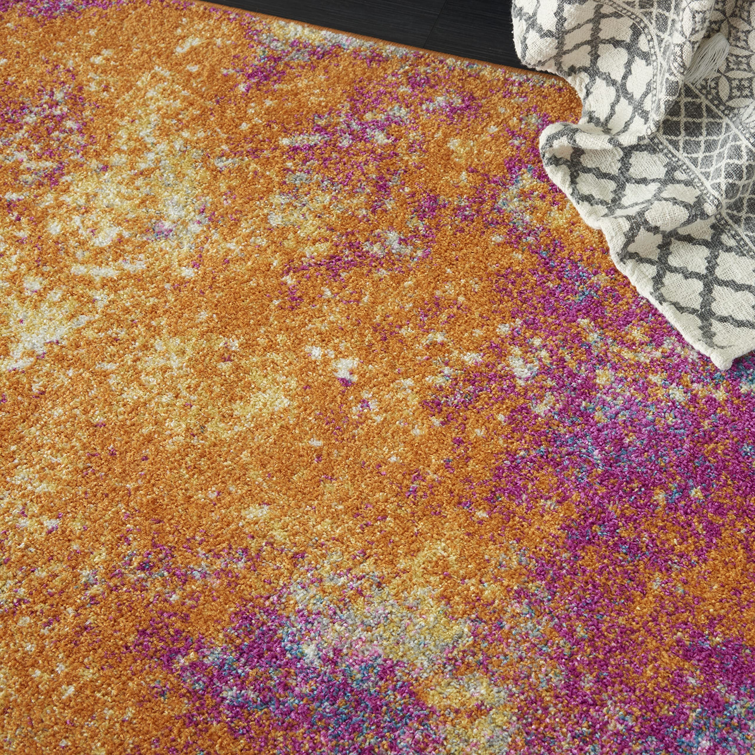 Nourison Passion Sunburst styled in living room adds warmth and visual movement