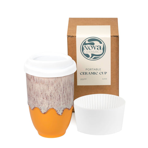 NOVA CERAMICS grapefruit front view showing orange-white glaze and lid, stylish on-the-go mug