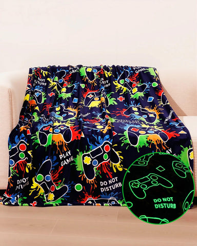 NuKuNsKf front view of navy gaming blanket showing glowing controller pattern and warmth