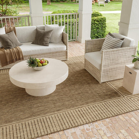 nuLOOM Asha on patio styled with seating showing outdoor resilience benefit