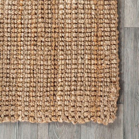nuLOOM artisan hands weaving jute showcasing handmade craftsmanship and uniqueness