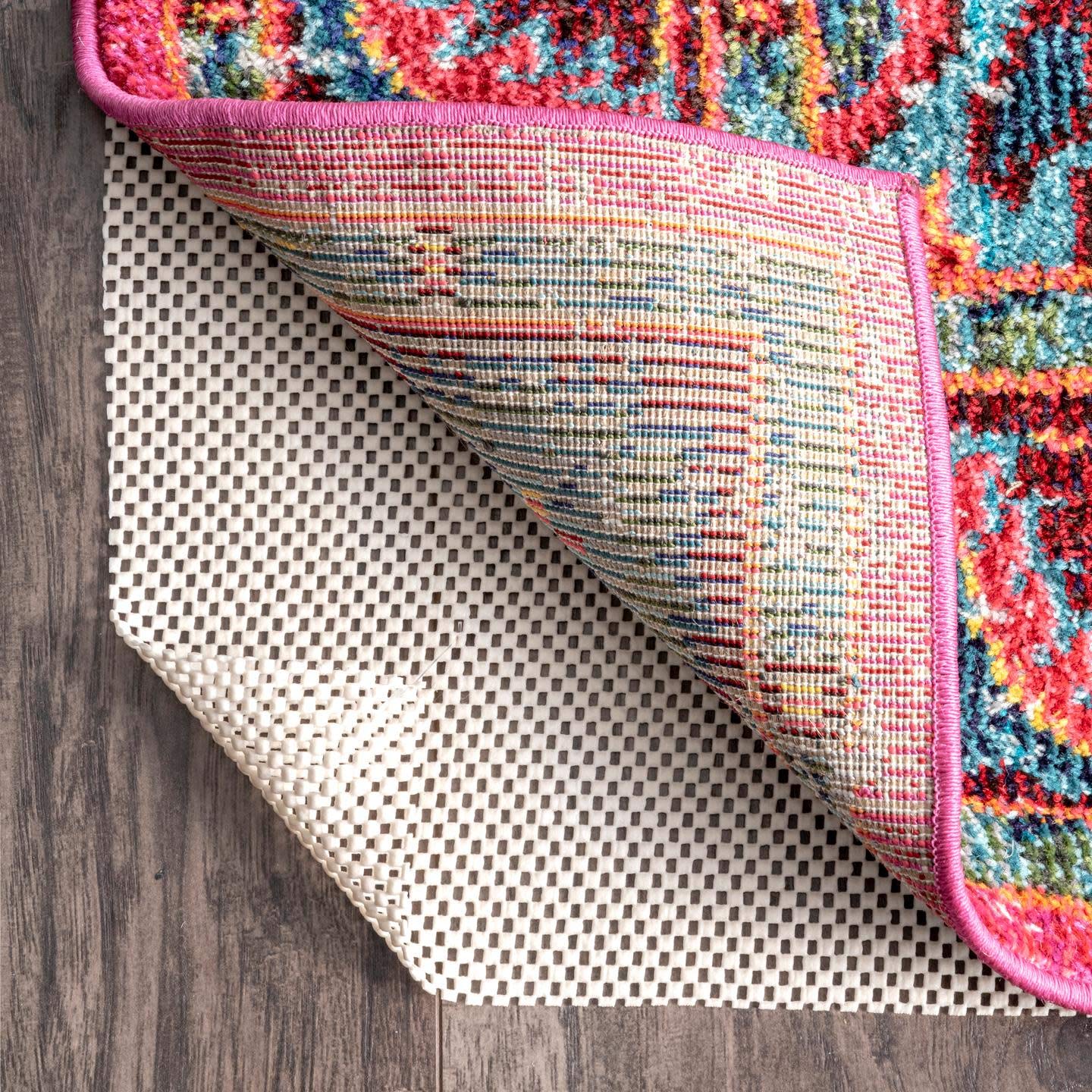 nuLOOM pad being trimmed with scissors to fit a custom runner for perfect fit