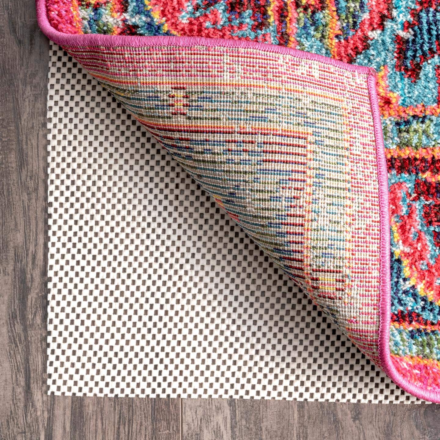 nuLOOM pad installed under a hallway runner stabilizing rug and preventing slips