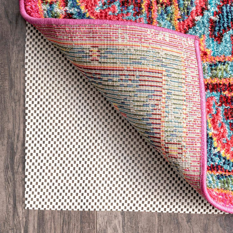 nuLOOM pad installed under a hallway runner stabilizing rug and preventing slips