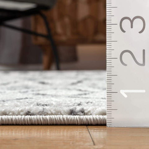 nuLOOM backing and manufacturing tag highlighting durable latex bond benefit