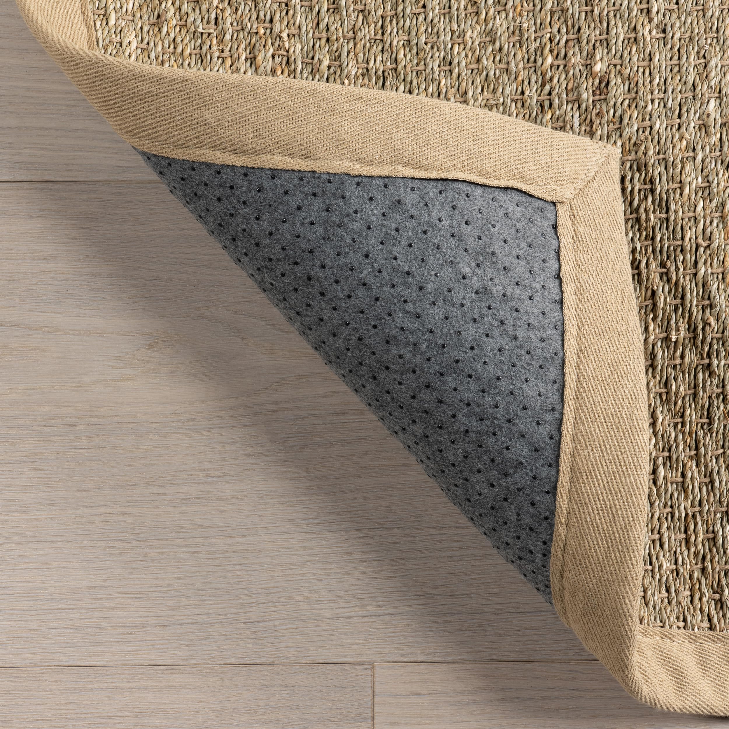 nuLOOM rolled rug and packaging, illustrates size, portability, and delivery condition
