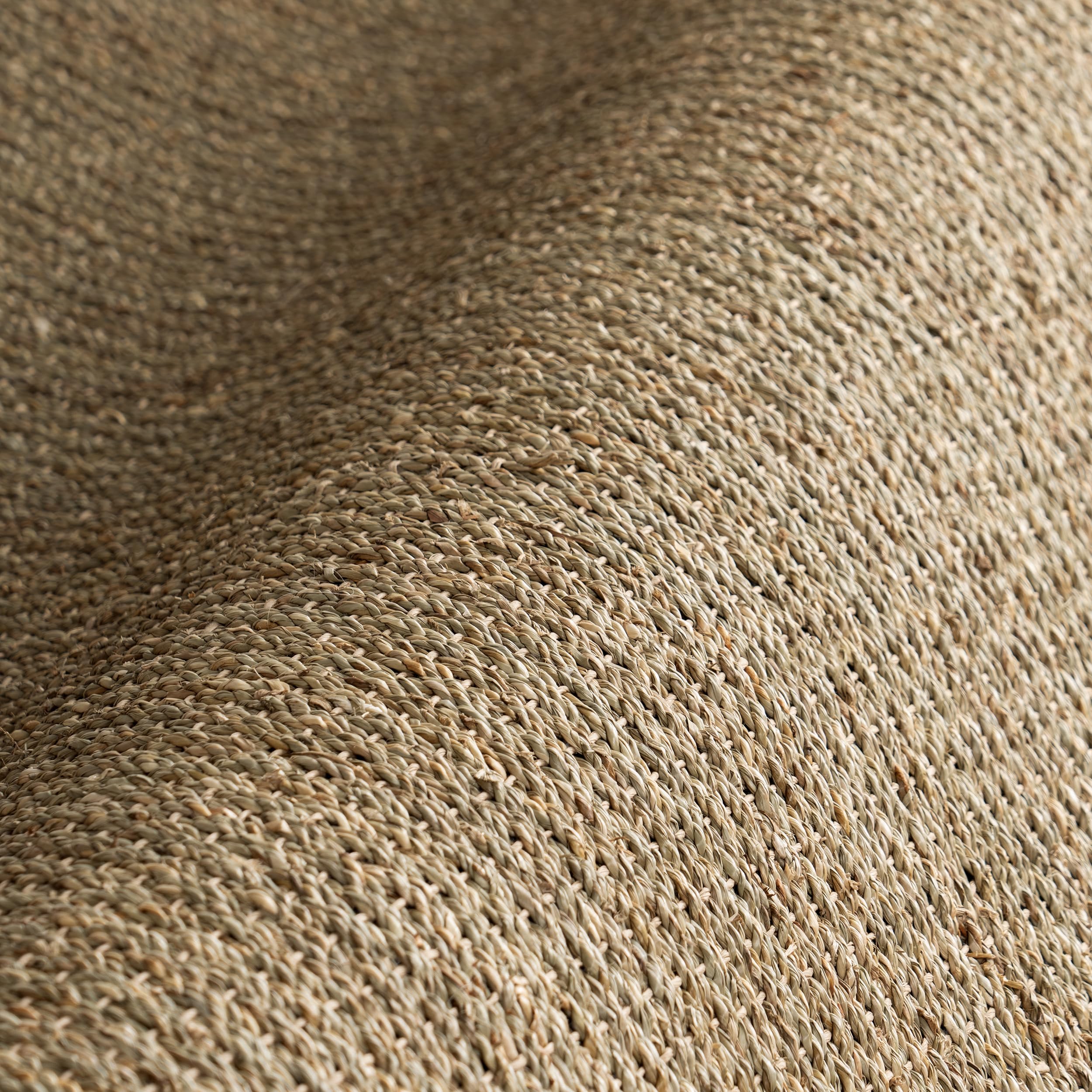 nuLOOM Elijah placed along a bed illustrating layered farmhouse or coastal styling