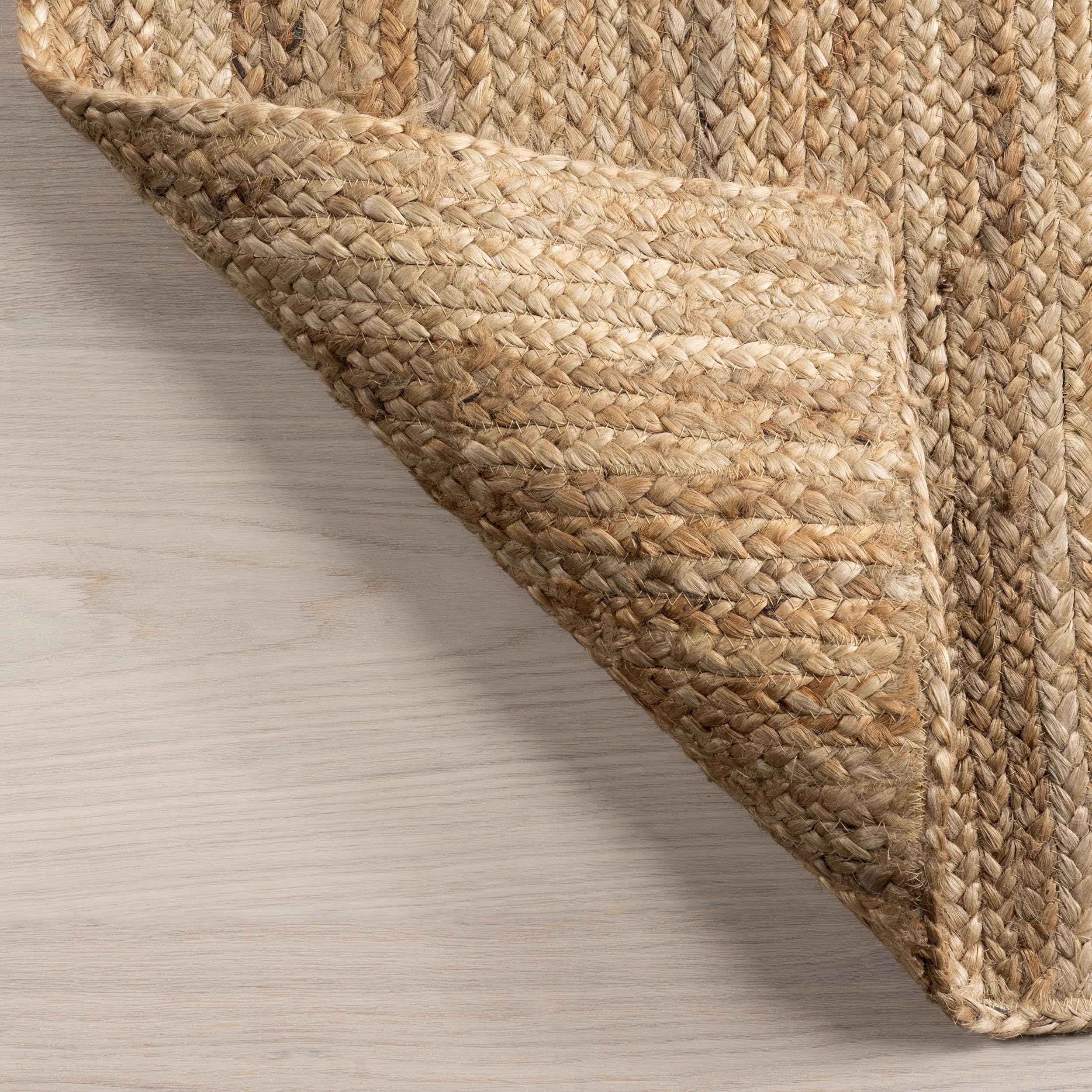 nuLOOM Rigo Natural under a coffee table creating layered look and cozy atmosphere