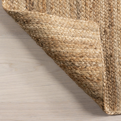 nuLOOM Rigo Natural under a coffee table creating layered look and cozy atmosphere