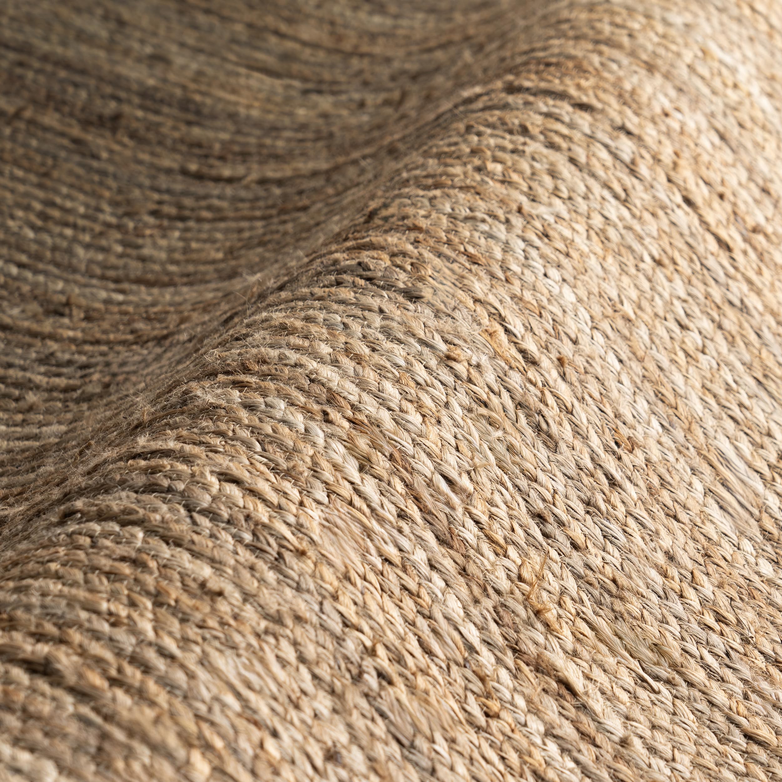 nuLOOM Rigo product label and material tag showing 100% jute sustainable composition