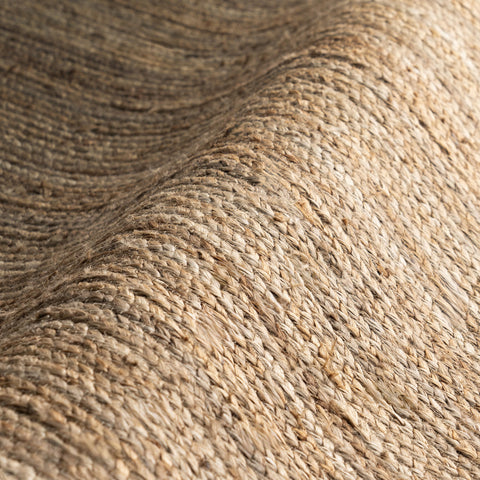 nuLOOM Rigo product label and material tag showing 100% jute sustainable composition