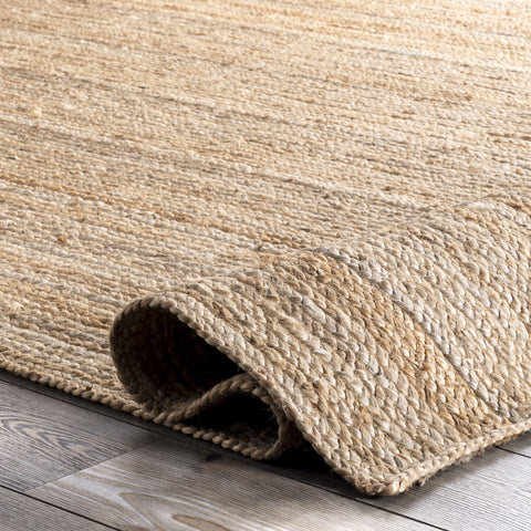 nuLOOM rug under dining table illustrating durable, easy-care surface for meals