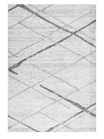 nuLOOM Thigpen front view in living room showing neutral abstract pattern and scale
