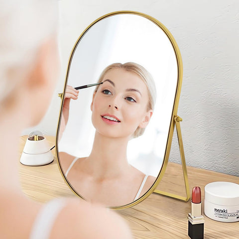 Numjeg mirror held by hand showing lightweight 22.5 oz design and travel-friendly benefit