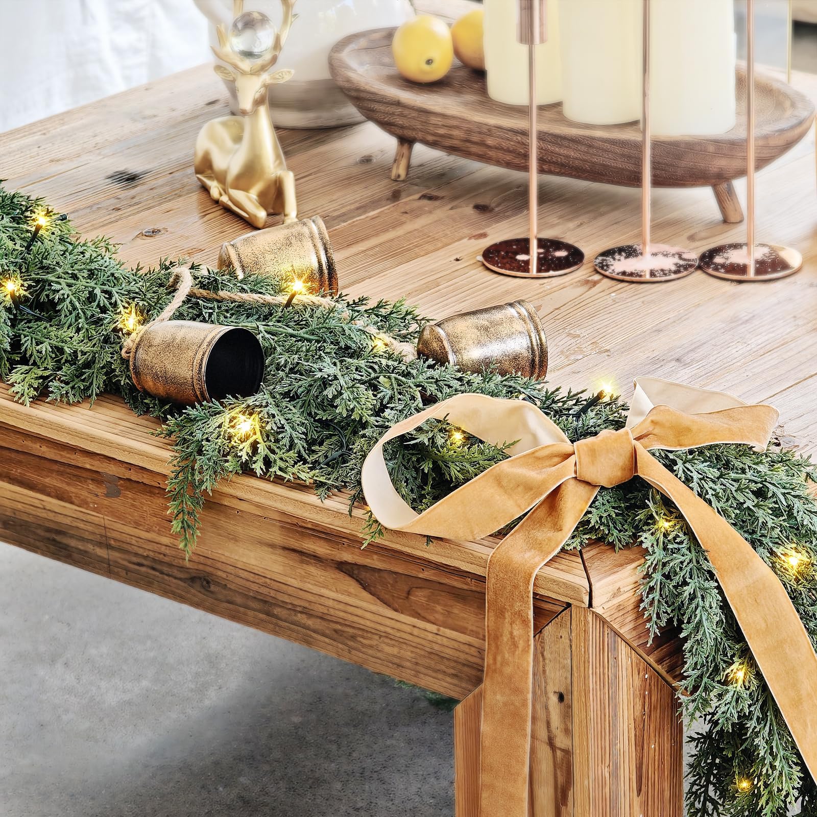 NUTIKAS cedar garland draped on stair rail adding cozy holiday atmosphere