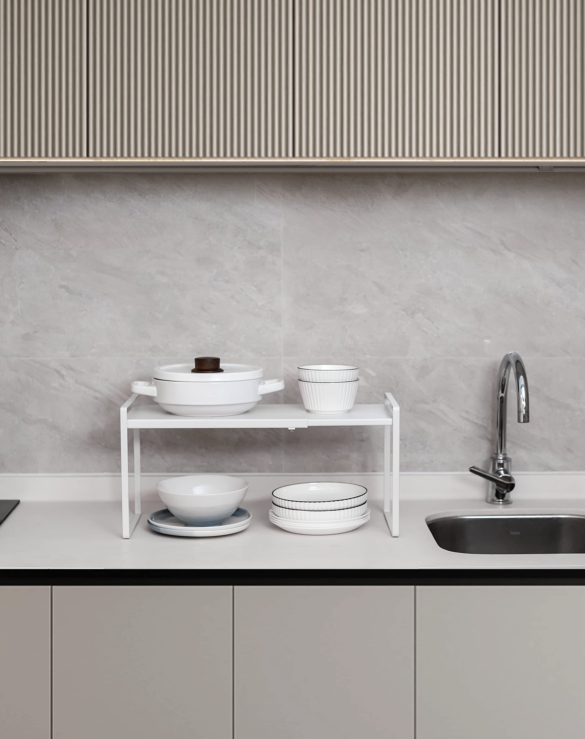 Nxconsu shelf on kitchen counter holding mugs and spices improving countertop neatness and reachability