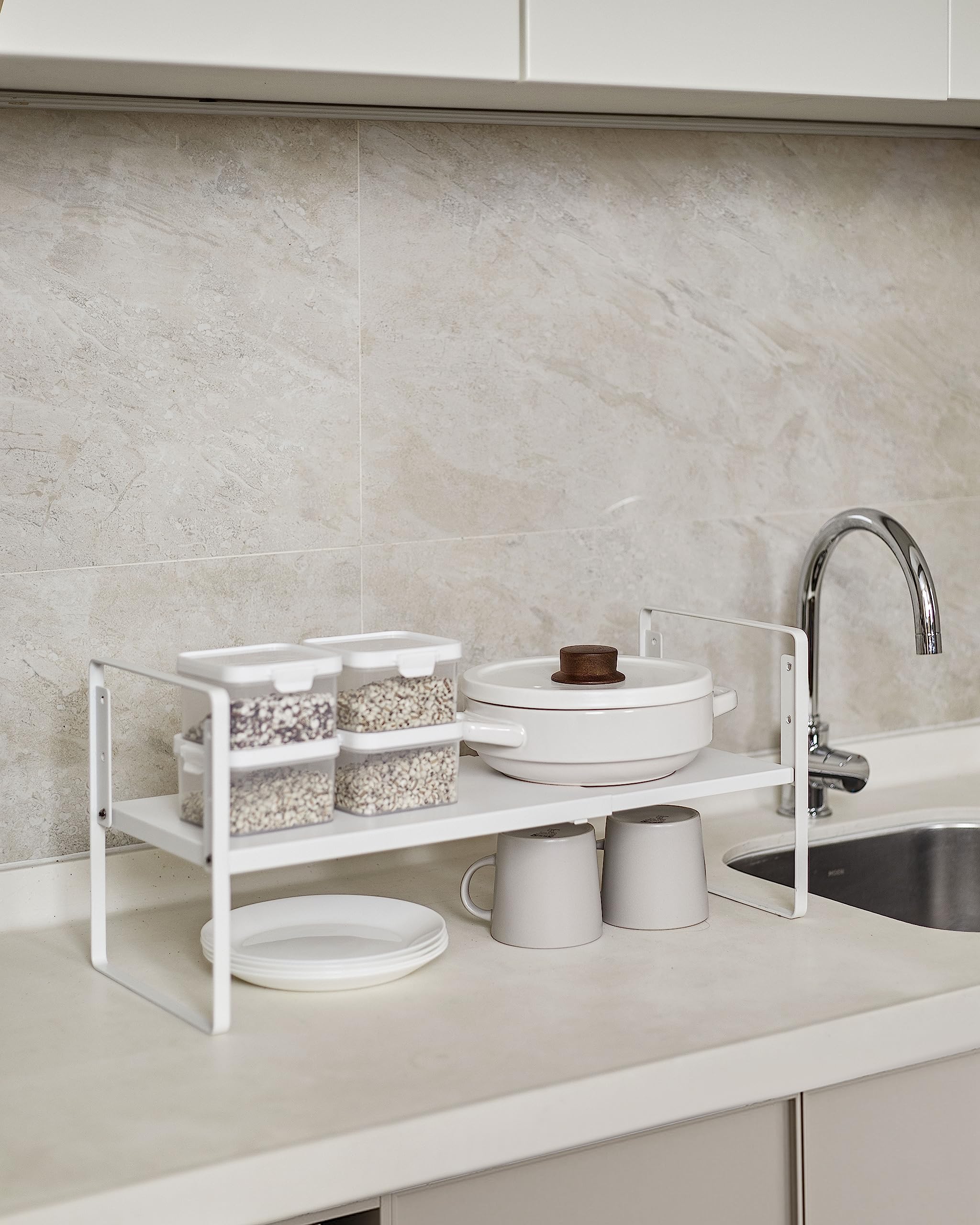 Nxconsu placed on countertop with spice jars and mugs creating organized counter space benefit
