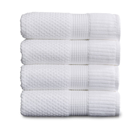 NY Loft front view of four white bath towels showing neat packaging and value