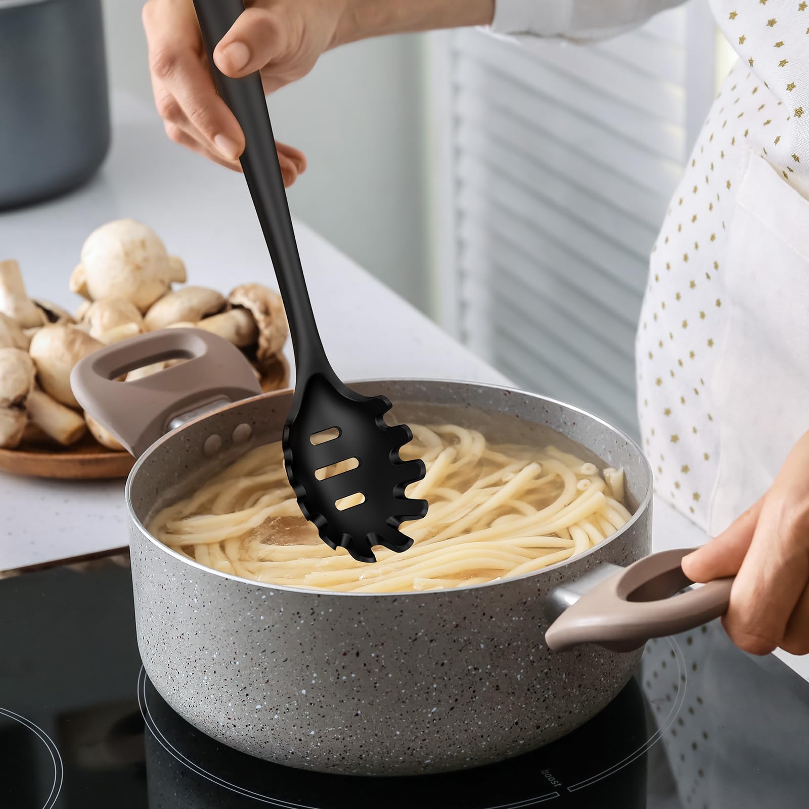 oannao utensil held in hand to show size and comfortable grip ergonomics