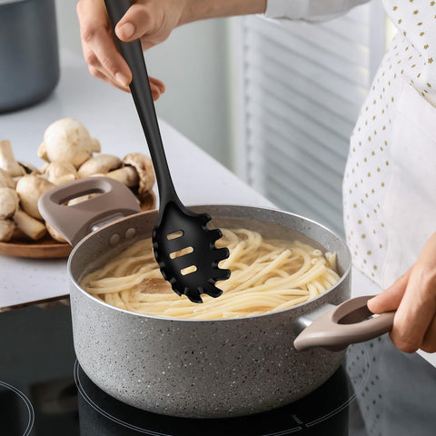 oannao utensil held in hand to show size and comfortable grip ergonomics