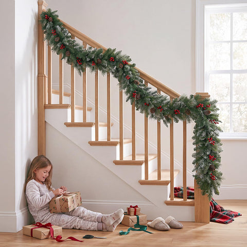OasisCraft garland on covered porch illustrating weather-resistant use