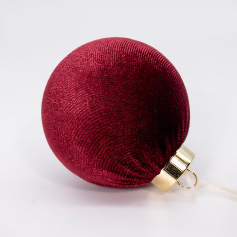 Obgora velvet ornaments hung on a decorated Christmas tree adding soft warmth