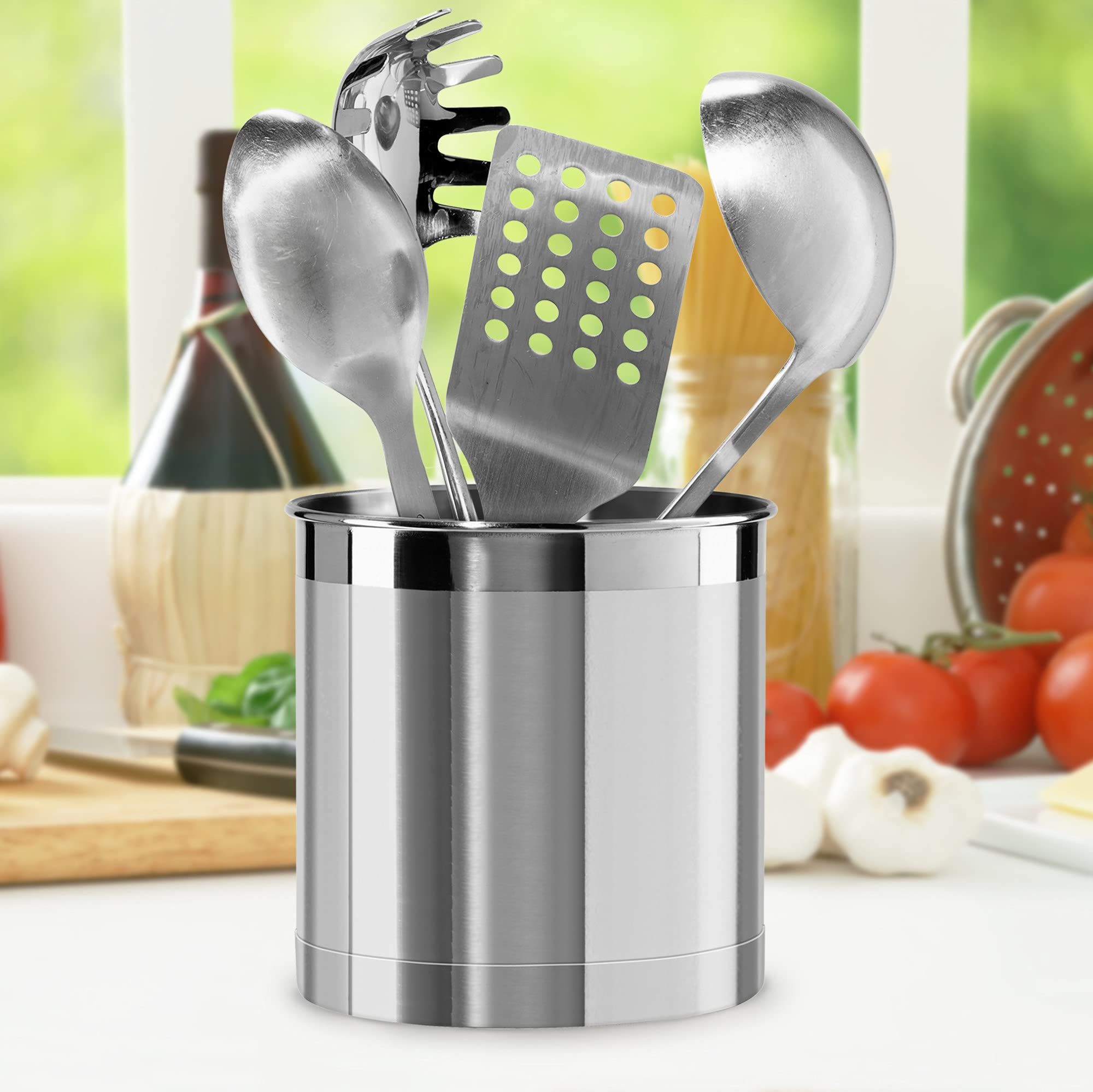 Oggi utensil crock filled with spatulas ladles and whisks for easy access while cooking