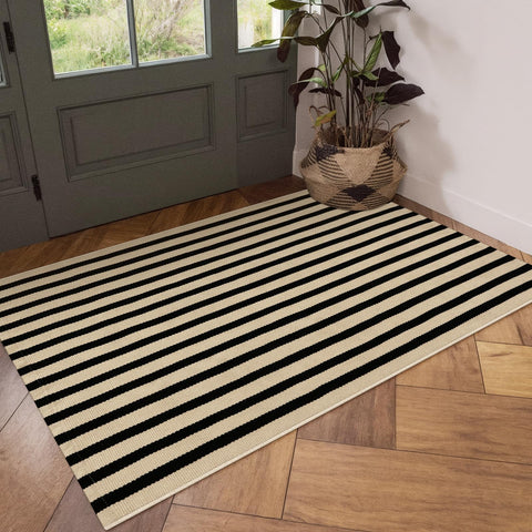 OJIA folded rug ready for washing emphasizing easy machine‑wash care