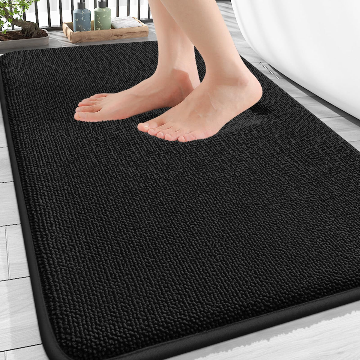 OLANLY front view of black bath mat showing neat edges and clean design for modern bathrooms