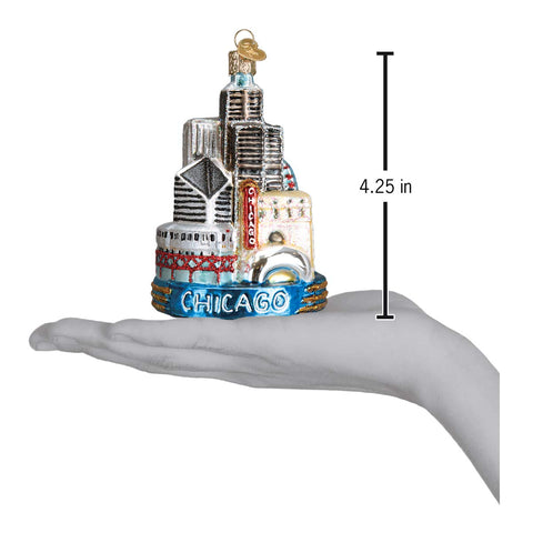 Old World Christmas ornament held in hand to show scale and gift suitability