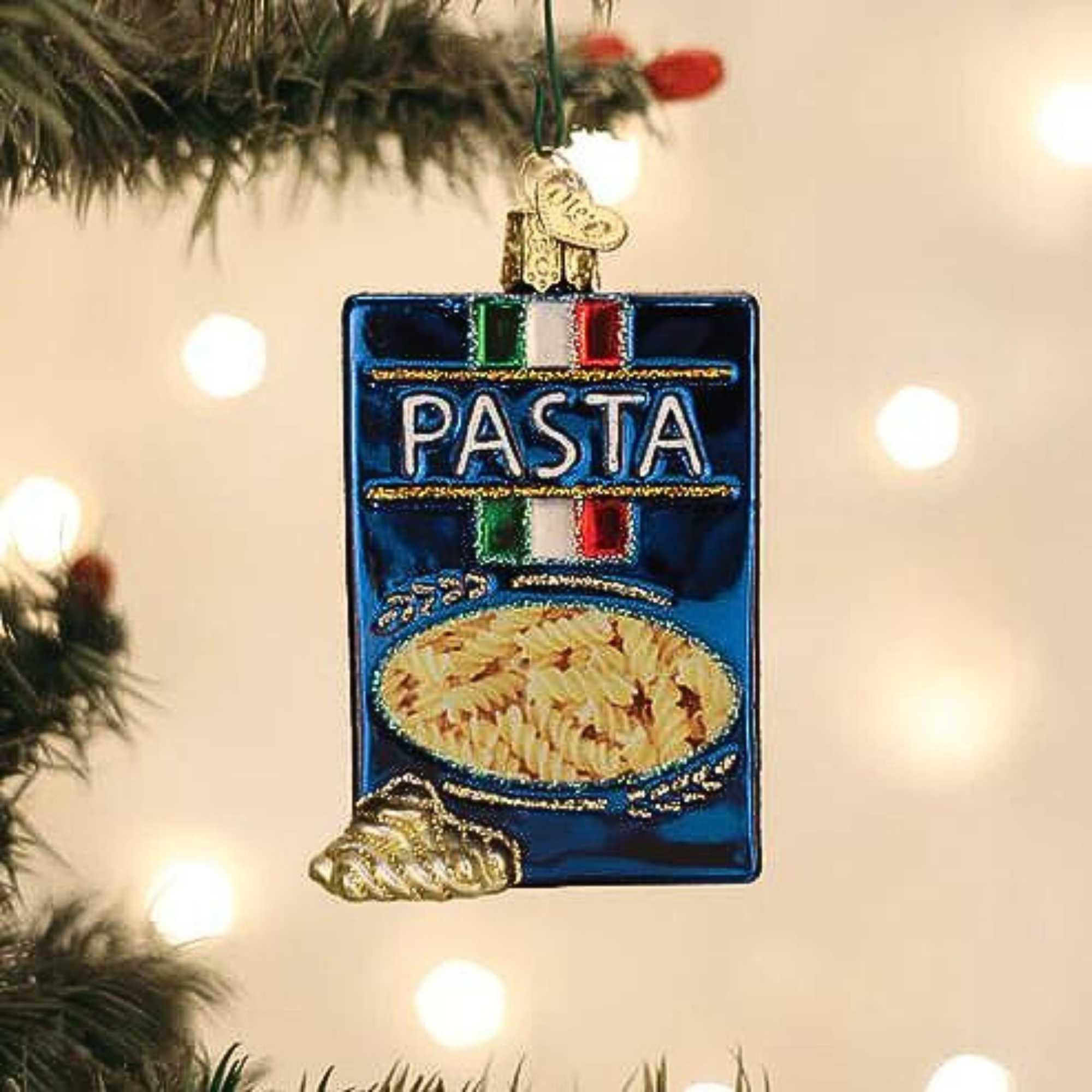 Old World Christmas ornament hanging on tree adding whimsical kitchen-themed sparkle