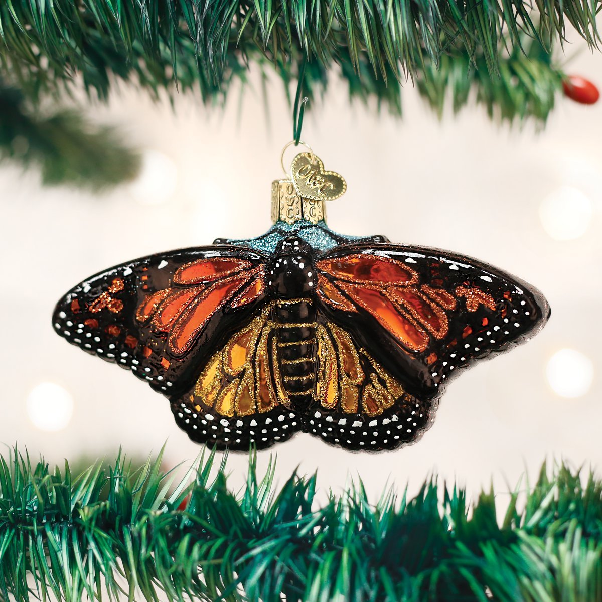 Old World Christmas close-up of monarch wing detail highlighting hand-painted gold edging
