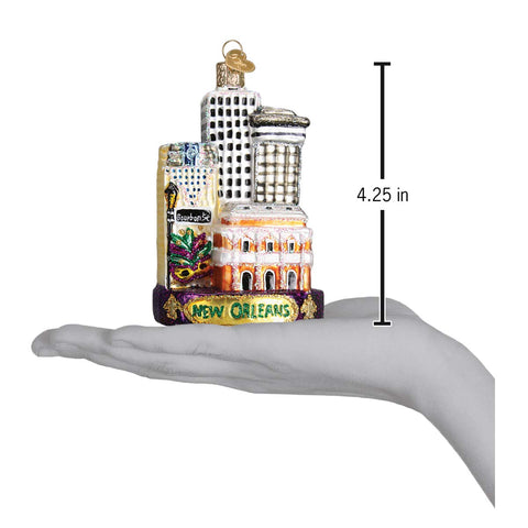 Old World Christmas ornament beside a ruler showing compact gift-friendly size