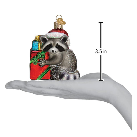 Old World Christmas raccoon hung on tree showing reflective accents and depth