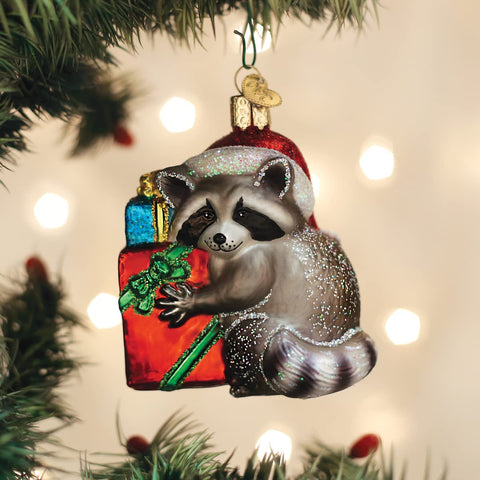 Old World Christmas raccoon size comparison in hand showing scale and gift readiness