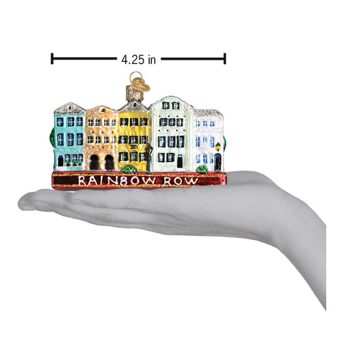 Old World Christmas ornament held in hand for scale demonstrating compact, collectible size
