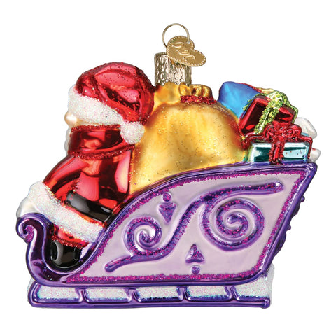 Old World Christmas close-up of hand-painted detail and glittered gifts highlighting artisanal finish