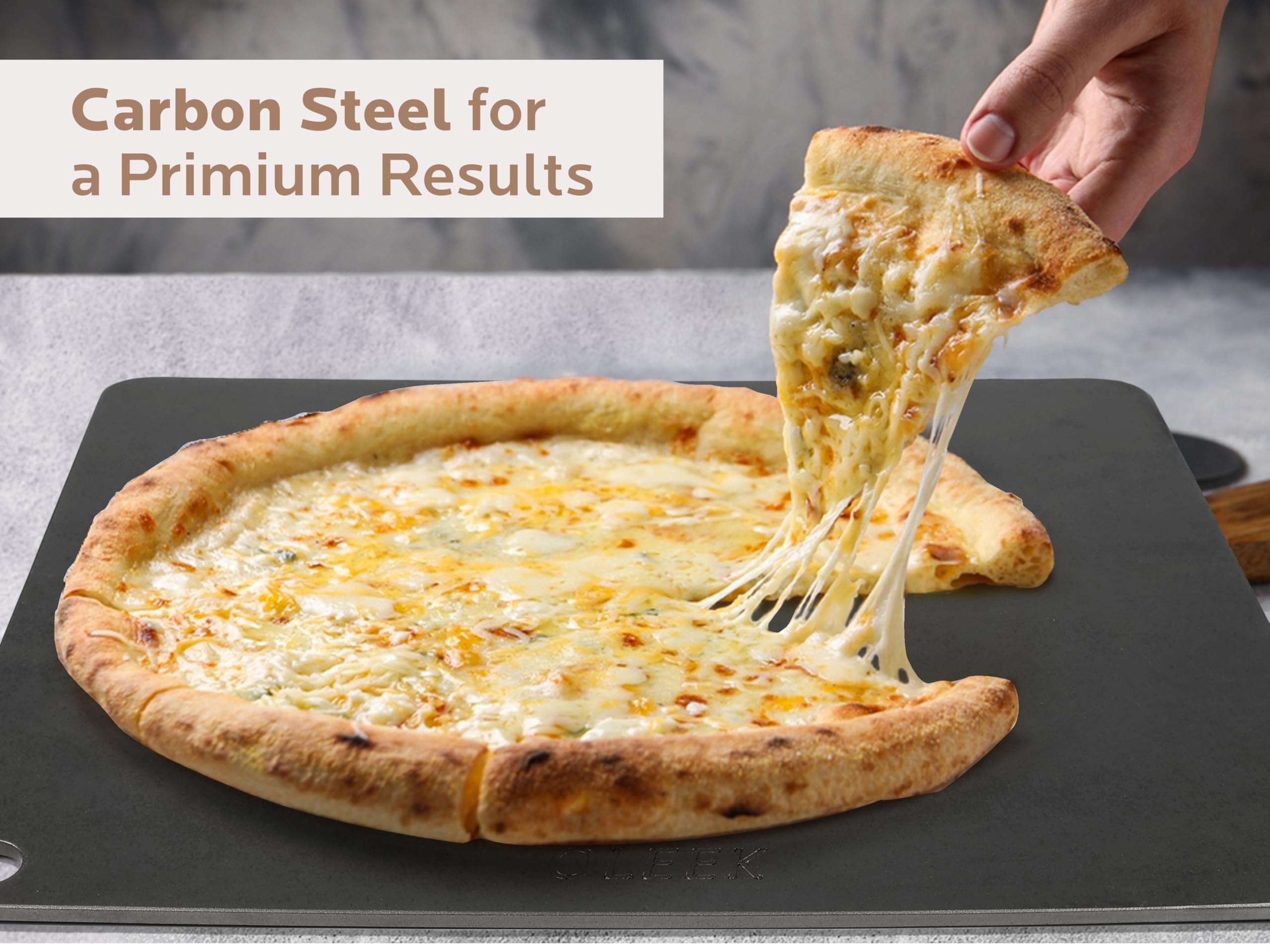 OLEEK pizza on steel inside oven demonstrating crisp, evenly browned crust
