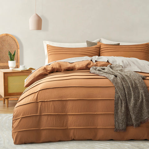 Oli Anderson duvet cover front view showing warm pumpkin tone and decorative pleats