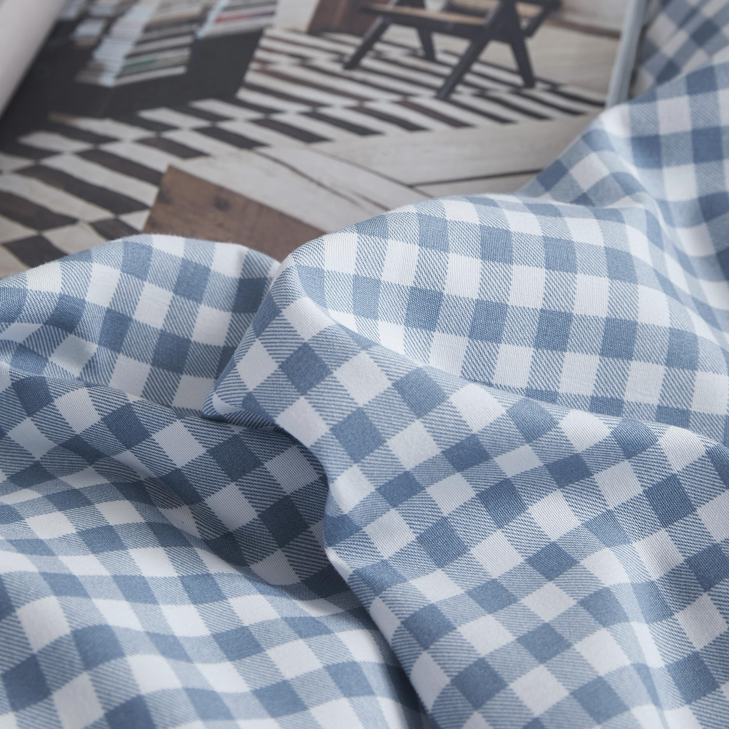 Oli Anderson folded comforter and pillowcases ready for wash showing easy-care convenience