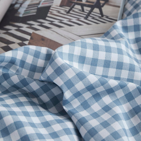 Oli Anderson folded comforter and pillowcases ready for wash showing easy-care convenience