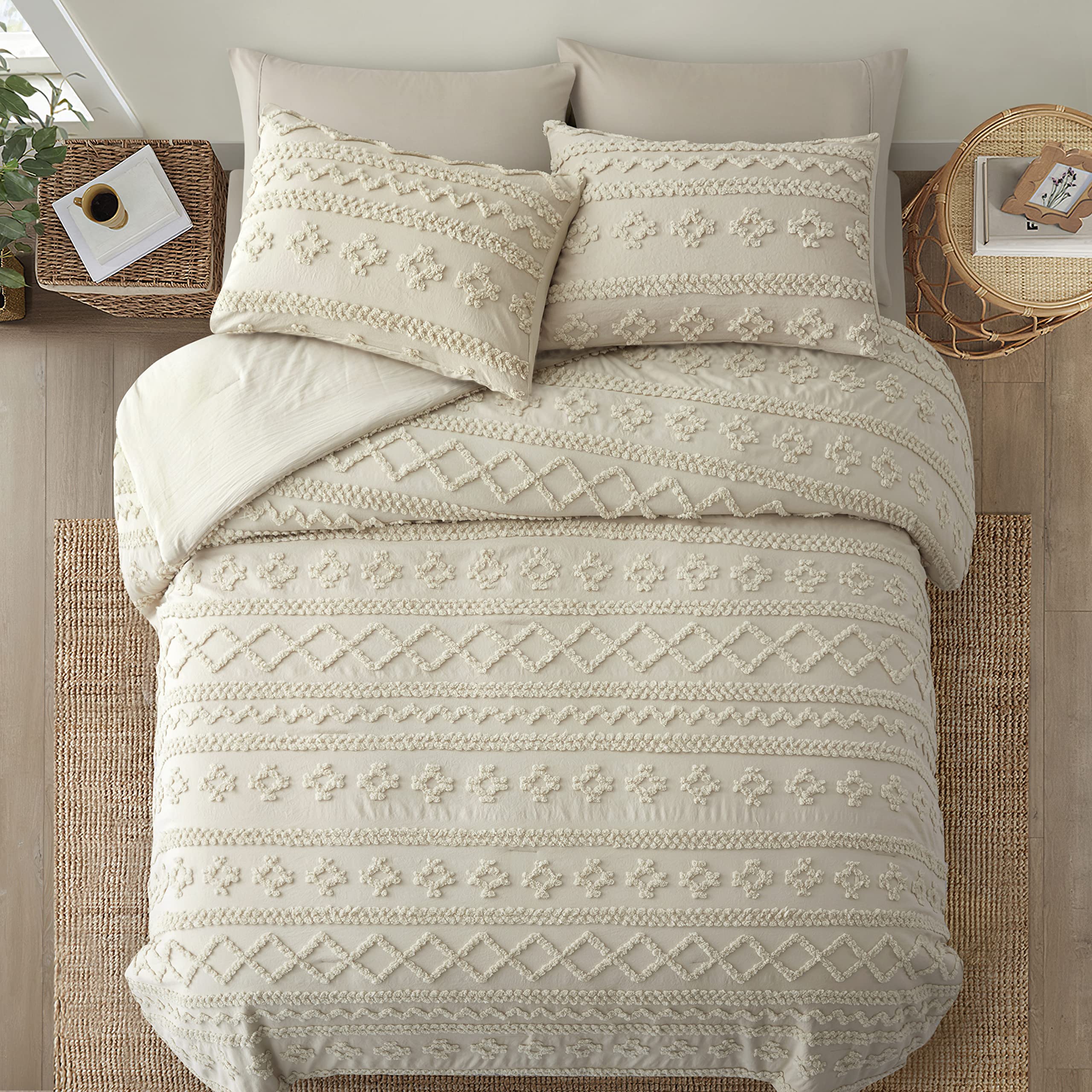 Oli Anderson comforter beside ruler showing king 102x88 dimensions for scale